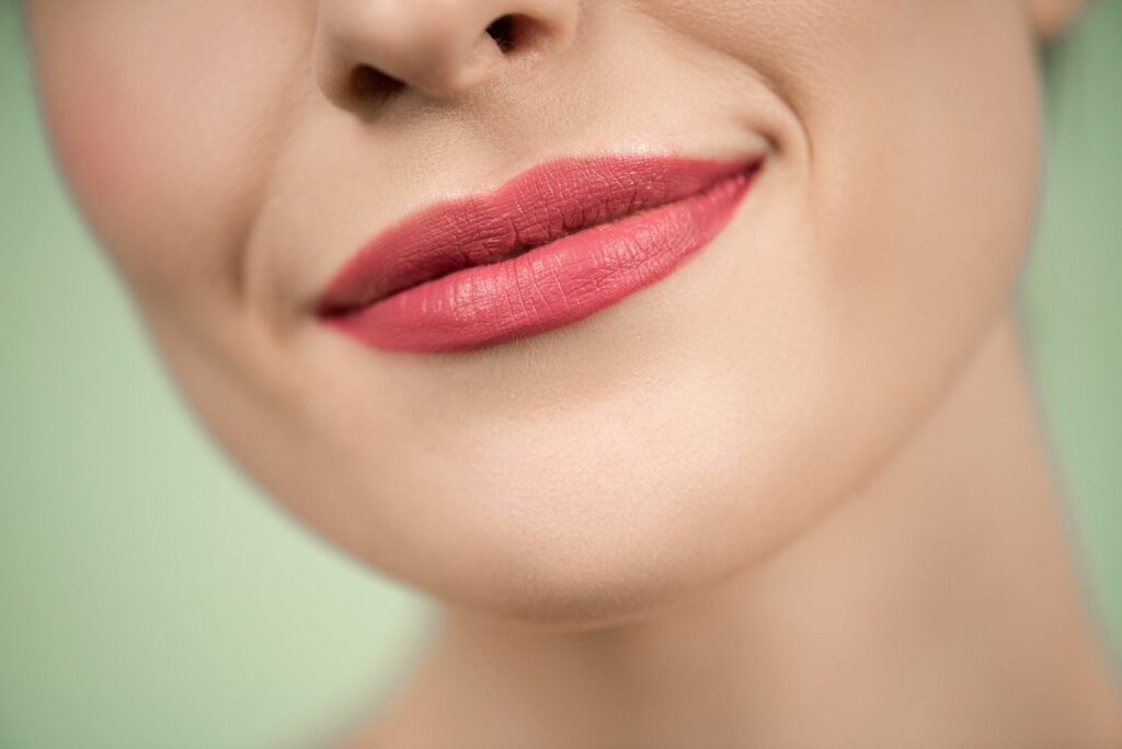 woman with red lipstick smiling