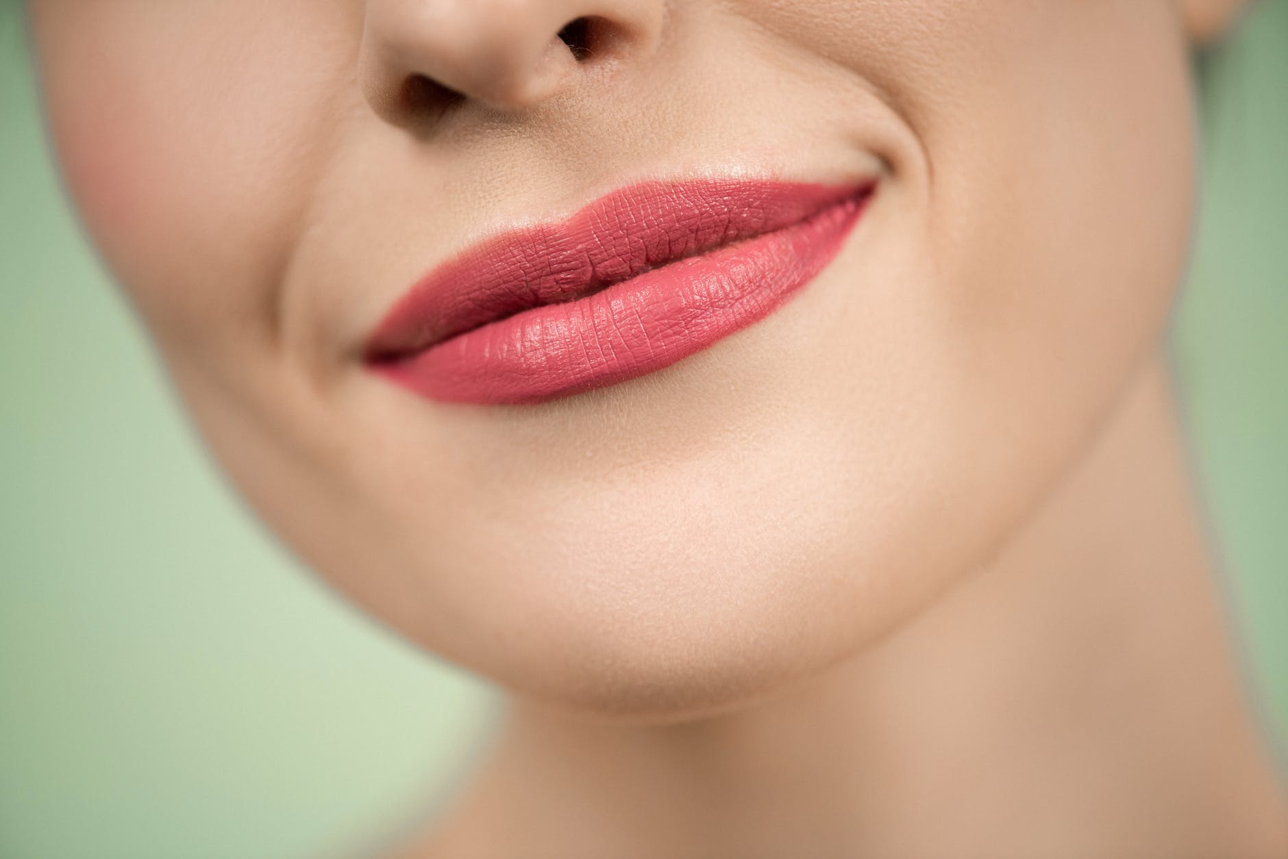 woman with red lipstick smiling