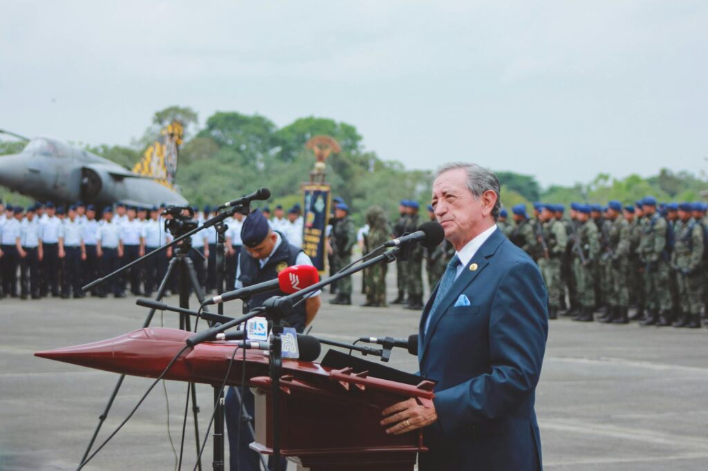 man in suit giving speech