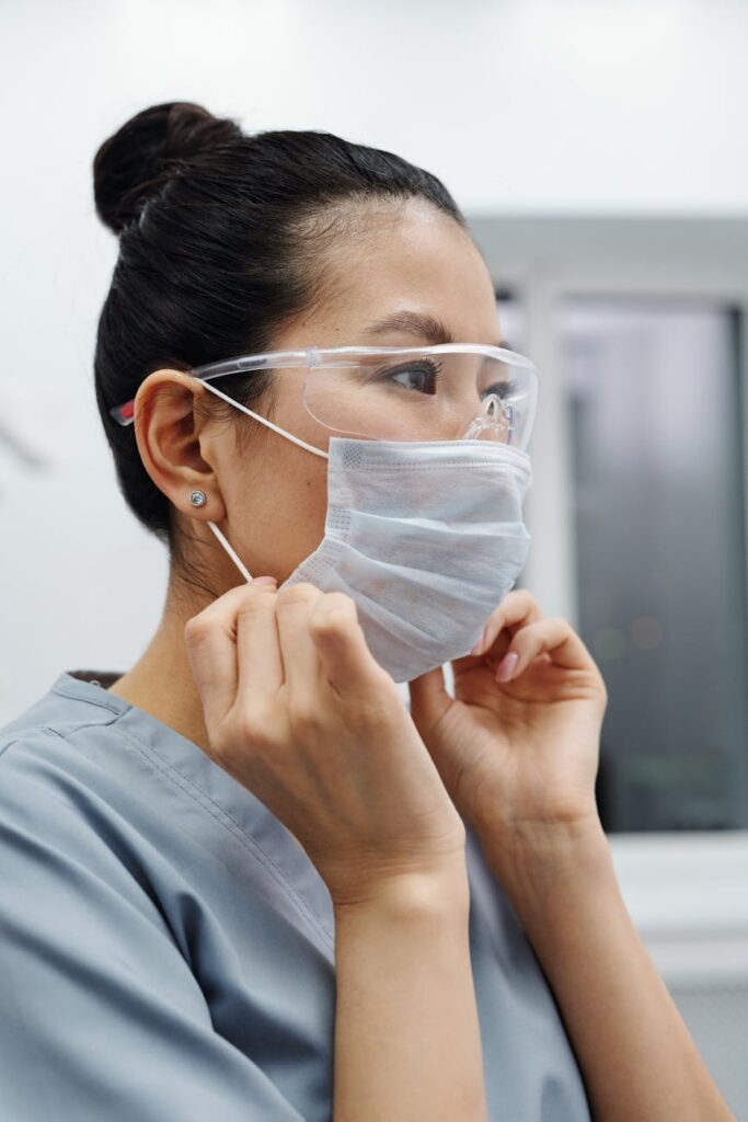 photo of woman wearing protective goggles and mask