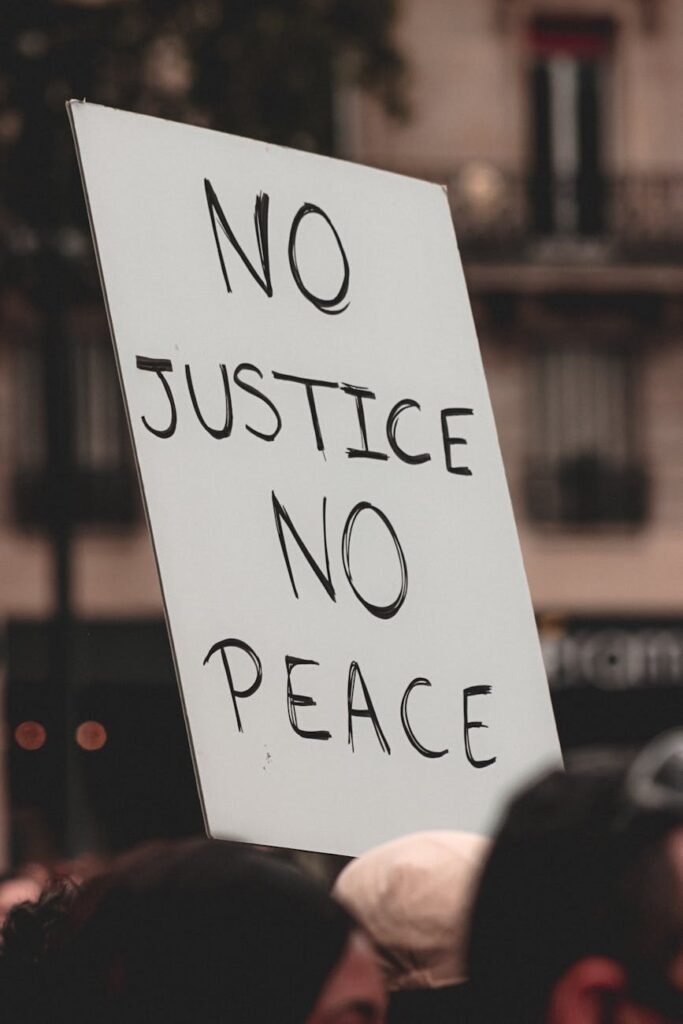 people protesting with handmade sign