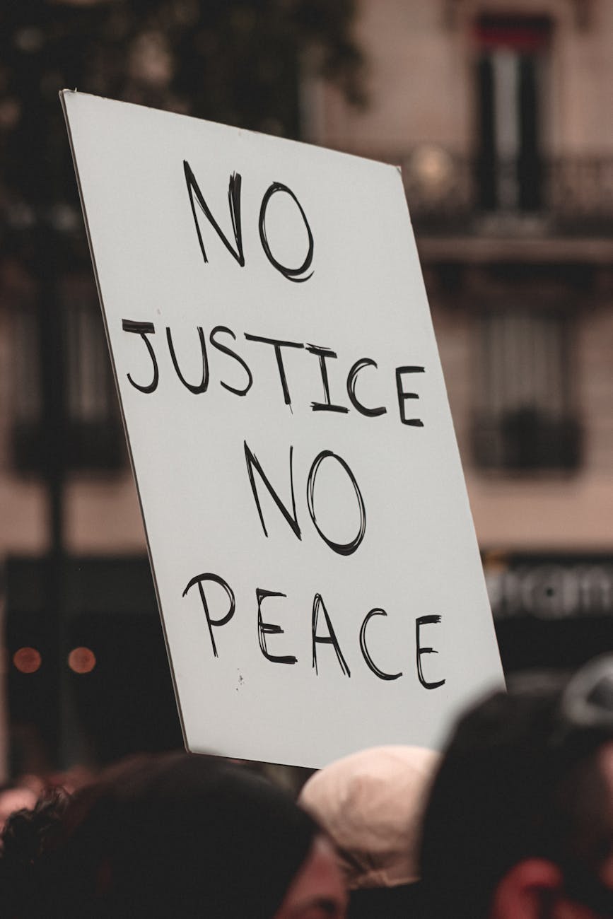 people protesting with handmade sign