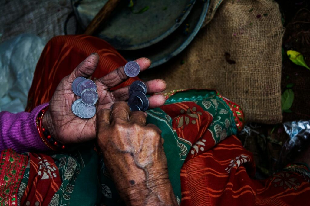 person holding coins